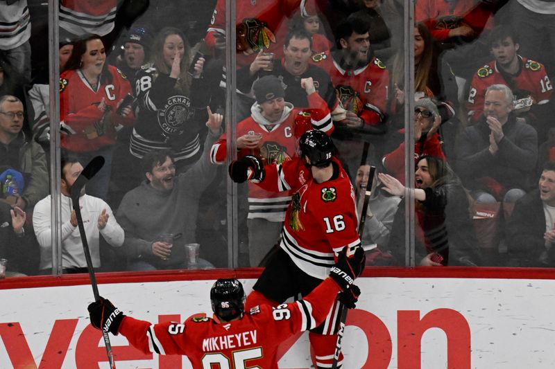 Jan 19, 2026; Chicago, Illinois, USA;  Chicago Blackhawks center Jason Dickinson (16) celebrates with fans after scoring a goal against the Winnipeg Jets during the second period at United Center. Mandatory Credit: Matt Marton-Imagn Images