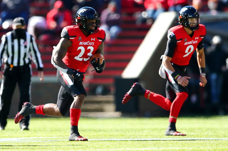 Oct 31, 2020; Cincinnati, OH, USA; Cincinnati Bearcats running back Gerrid Doaks (23) carries the ball during the second quarter of a college football game against the Memphis Tigers, Saturday, Oct. 31, 2020, at Nippert Stadium in Cincinnati. The Cincinnati Bearcats lead 21-10.  Mandatory Credit: Kareem Elgazzar-USA TODAY NETWORK