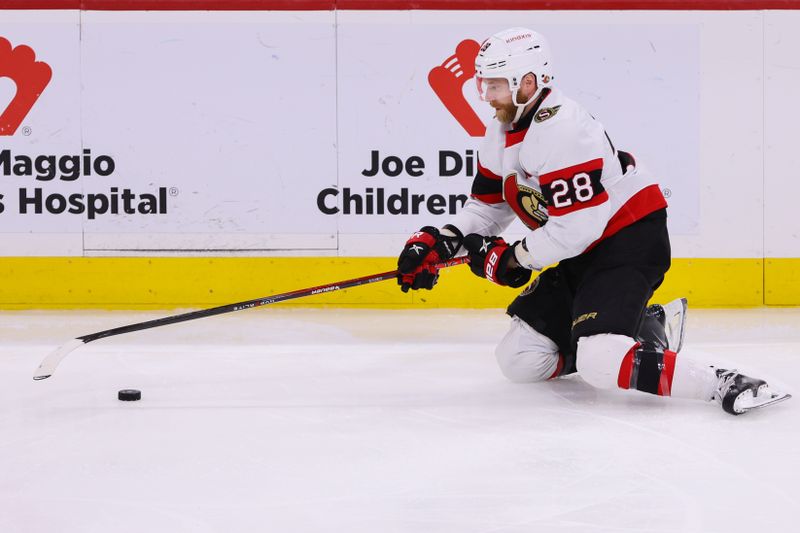 Apr 9, 2024; Sunrise, Florida, USA; Ottawa Senators right wing Claude Giroux (28) moves the puck against the Florida Panthers during the third period at Amerant Bank Arena. Mandatory Credit: Sam Navarro-USA TODAY Sports