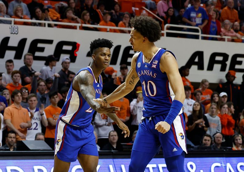 Feb 14, 2023; Stillwater, Oklahoma, USA;  Kansas Jayhawks forward Jalen Wilson (10) and Kansas Jayhawks guard Dajuan Harris Jr. (3) celebrate after a basket against the Oklahoma State Cowboys during the second half at Gallagher-Iba Arena. Kansas won 87-76. Mandatory Credit: Alonzo Adams-USA TODAY Sports