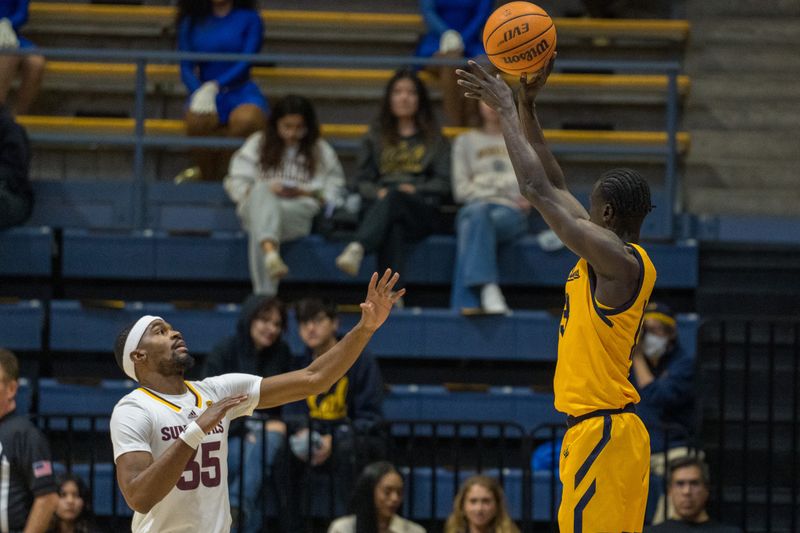 Feb 11, 2023; Berkeley, California, USA; California Golden Bears forward Kuany Kuany (13) shoot the basketball against Arizona State Sun Devils guard Devan Cambridge (35) during the first half at Haas Pavilion. Mandatory Credit: Neville E. Guard-USA TODAY Sports