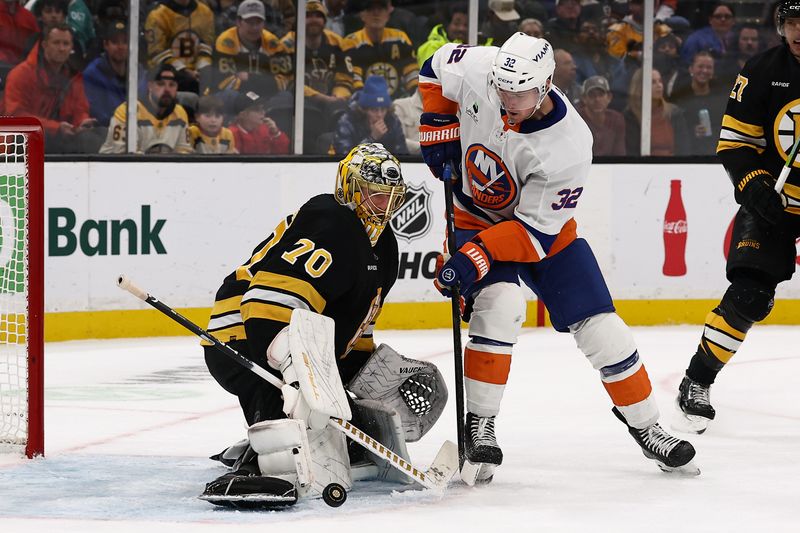 Oct 28, 2025; Boston, Massachusetts, USA; New York Islanders center Kyle MacLean (32) looks for a rebound off a save by Boston Bruins goaltender Joonas Korpisalo (70) during the third period at TD Garden. Mandatory Credit: Winslow Townson-Imagn Images