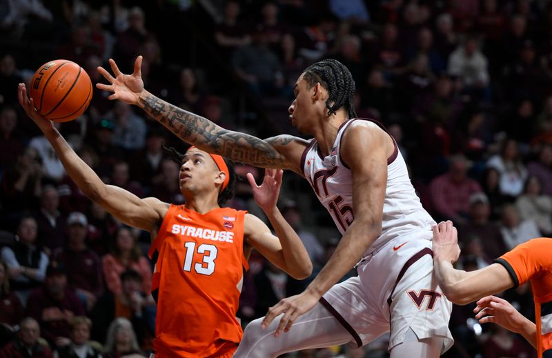 Jan 28, 2023; Blacksburg, Virginia, USA; Syracuse Orange forward Benny Williams (13) gets his hand on the ball in front of Virginia Tech Hokies center Lynn Kidd (15) in the second half at Cassell Coliseum. Mandatory Credit: Lee Luther Jr.-USA TODAY Sports