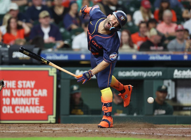 May 13, 2024; Houston, Texas, USA; Houston Astros second baseman Jose Altuve (27) reacts to being hit by a pitch against the Oakland Athletics in the third inning  at Minute Maid Park. Mandatory Credit: Thomas Shea-USA TODAY Sports