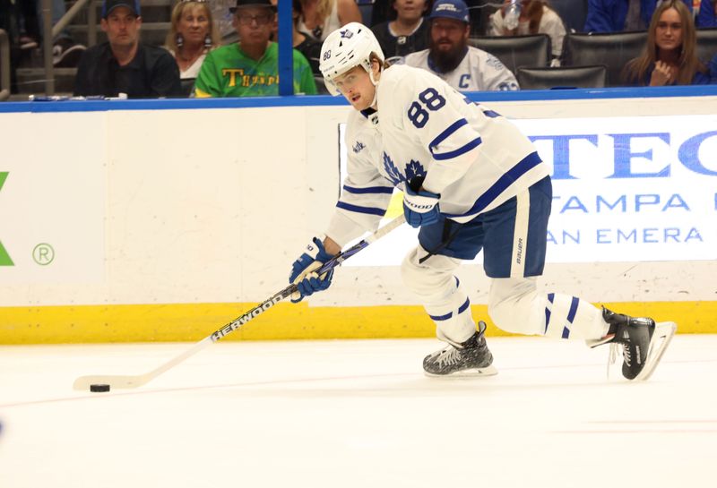 Apr 17, 2024; Tampa, Florida, USA; Toronto Maple Leafs right wing William Nylander (88) skates with the puck against the Tampa Bay Lightning during the second period at Amalie Arena. Mandatory Credit: Kim Klement Neitzel-USA TODAY Sports