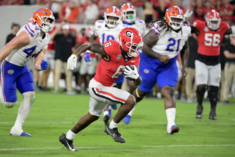 Nov 2, 2024; Jacksonville, Florida, USA; Georgia Bulldogs wide receiver Dominic Lovett (6) scores the go ahead touchdown against the Florida Gators during the second half at EverBank Stadium. Mandatory Credit: Melina Myers-Imagn Images