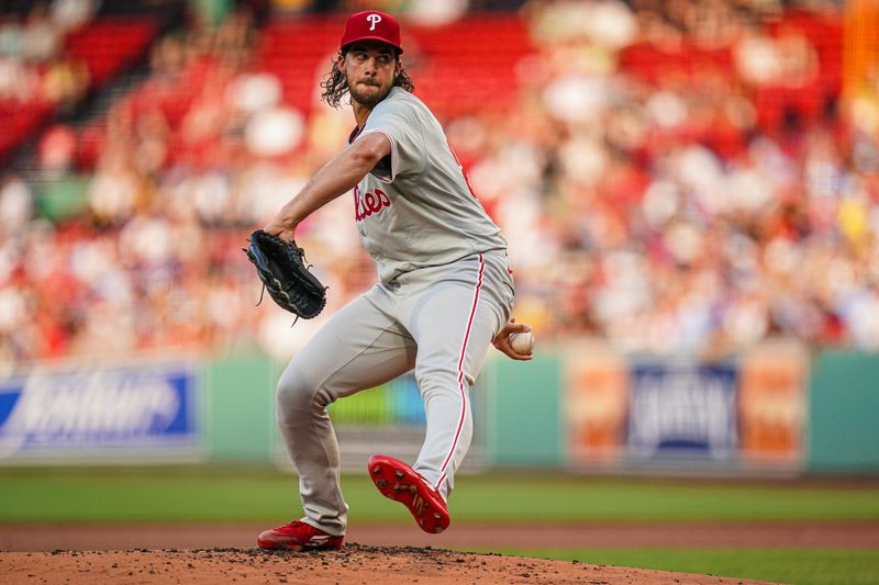 Jun 13, 2024; Boston, Massachusetts, USA; Philadelphia Phillies starting pitcher Aaron Nola (27) throws a pitch against the Boston Red Sox in the first inning at Fenway Park. Mandatory Credit: David Butler II-USA TODAY Sports