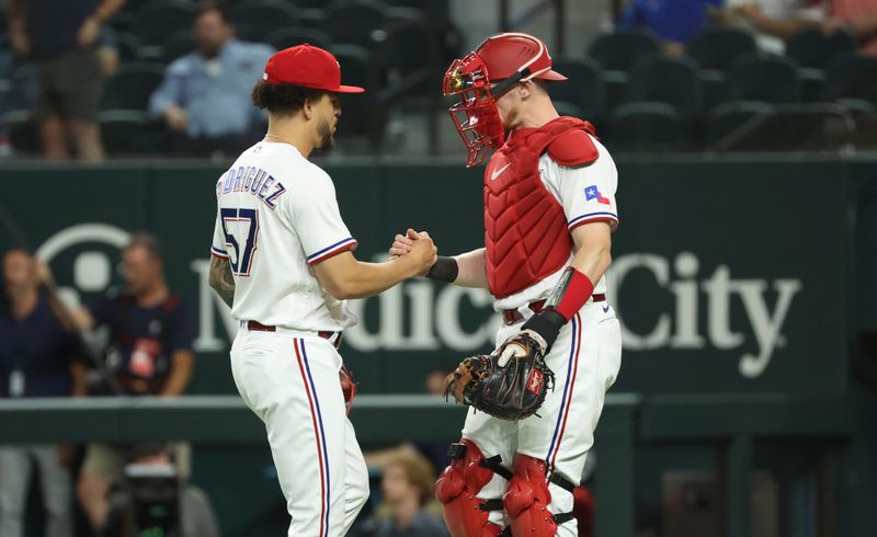 Jun 28, 2023; Arlington, Texas, USA;  Texas Rangers relief pitcher Yerry Rodriguez (57) celebrates with Texas Rangers catcher Sam Huff (55) after the game against the Detroit Tigers at Globe Life Field. Mandatory Credit: Kevin Jairaj-USA TODAY Sports