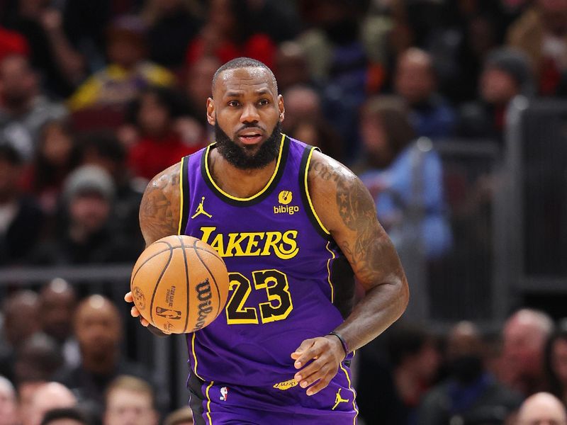 CHICAGO, ILLINOIS - DECEMBER 20: LeBron James #23 of the Los Angeles Lakers dribbles up the court against the Chicago Bulls during the first half at the United Center on December 20, 2023 in Chicago, Illinois. NOTE TO USER: User expressly acknowledges and agrees that, by downloading and or using this photograph, User is consenting to the terms and conditions of the Getty Images License Agreement.  (Photo by Michael Reaves/Getty Images)