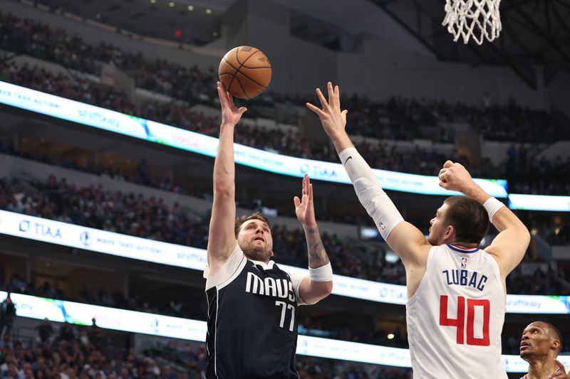 DALLAS, TX - APRIL 28: Luka Doncic #77 of the Dallas Mavericks shoots the ball during the game against the LA Clippers during Round 1 Game 4 of the 2024 NBA Playoffs on April 28, 2024 at the American Airlines Center in Dallas, Texas. NOTE TO USER: User expressly acknowledges and agrees that, by downloading and or using this photograph, User is consenting to the terms and conditions of the Getty Images License Agreement. Mandatory Copyright Notice: Copyright 2024 NBAE (Photo by Tim Heitman/NBAE via Getty Images)