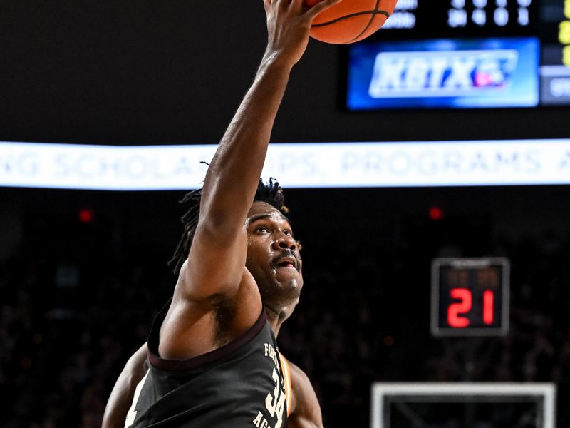 Feb 21, 2023; College Station, Texas, USA;  Texas A&M Aggies forward Julius Marble (34) controls the ball against the Tennessee Volunteers during the second half at Reed Arena. Mandatory Credit: Maria Lysaker-USA TODAY Sports