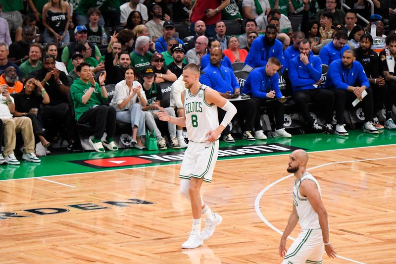 BOSTON, MA - JUNE 6: Kristaps Porzingis #8 of the Boston Celtics celebrates during the game against the Dallas Mavericks during Game 1 of the 2024 NBA Finals on June 6, 2024 at the TD Garden in Boston, Massachusetts. NOTE TO USER: User expressly acknowledges and agrees that, by downloading and or using this photograph, User is consenting to the terms and conditions of the Getty Images License Agreement. Mandatory Copyright Notice: Copyright 2024 NBAE  (Photo by Brian Babineau/NBAE via Getty Images)