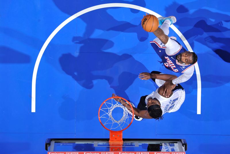 ORLANDO, FL - OCTOBER 18: Andre Drummond #5 of the Philadelphia 76ers rebounds the ball during the game against the Orlando Magic during a NBA preseason game on October 18, 2024 at Kia Center in Orlando, Florida. NOTE TO USER: User expressly acknowledges and agrees that, by downloading and or using this photograph, User is consenting to the terms and conditions of the Getty Images License Agreement. Mandatory Copyright Notice: Copyright 2024 NBAE (Photo by Fernando Medina/NBAE via Getty Images)