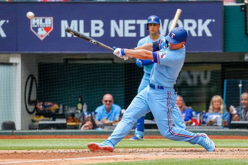 May 21, 2023; Arlington, Texas, USA; Texas Rangers designated hitter Corey Seager (5) hits an RBI double during the fifth inning against the Colorado Rockies at Globe Life Field. Mandatory Credit: Andrew Dieb-USA TODAY Sports