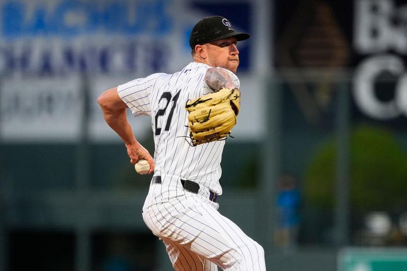 Sep 16, 2025; Denver, Colorado, USA; Colorado Rockies pitcher Kyle Freeland (21) delivers a pitch in the first inning against the Miami Marlins at Coors Field. Mandatory Credit: Ron Chenoy-Imagn Images