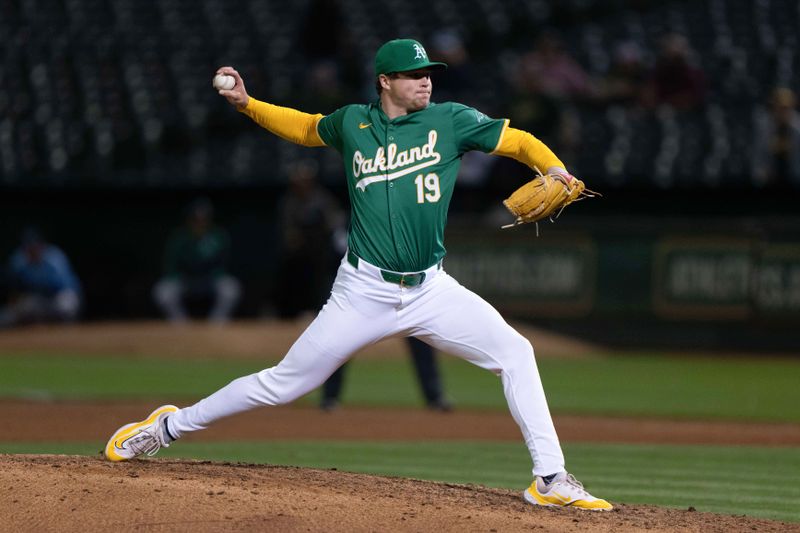 Aug 19, 2024; Oakland, California, USA; Oakland Athletics pitcher Mason Miller (19) pitches during the ninth inning against the Tampa Bay Rays at Oakland-Alameda County Coliseum. Mandatory Credit: Stan Szeto-USA TODAY Sports