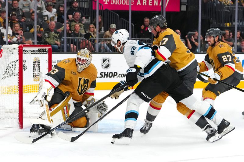 Sep 27, 2024; Las Vegas, Nevada, USA; Vegas Golden Knights goaltender Adin Hill (33) makes a save against Utah Hockey Club forward Kevin Stenlund (82) during the third period at T-Mobile Arena. Mandatory Credit: Stephen R. Sylvanie-Imagn Images