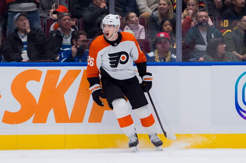 Dec 28, 2023; Vancouver, British Columbia, CAN; Philadelphia Flyers defenseman Sean Walker (26) celebrates his goal against the Vancouver Canucks in the second period at Rogers Arena. Mandatory Credit: Bob Frid-USA TODAY Sports