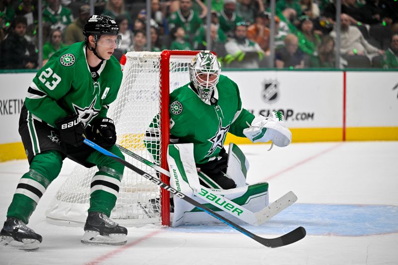 Oct 12, 2024; Dallas, Texas, USA; Dallas Stars defenseman Esa Lindell (23) and left wing Jamie Benn (14) face the New York Islanders attack during the third period at the American Airlines Center. Mandatory Credit: Jerome Miron-Imagn Images