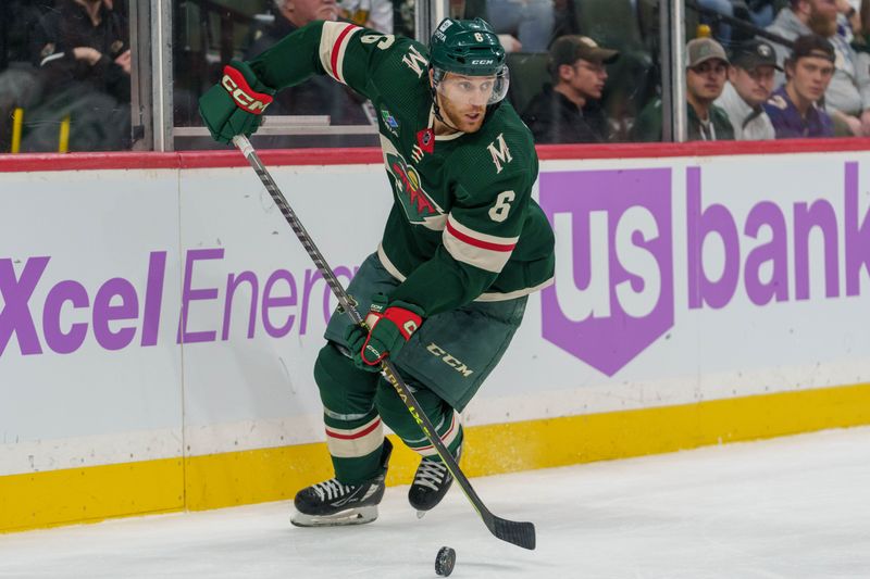 Nov 12, 2023; Saint Paul, Minnesota, USA; Minnesota Wild defenseman Dakota Mermis (6) skates with the puck against the Dallas Stars in the third period at Xcel Energy Center. Mandatory Credit: Matt Blewett-USA TODAY Sports