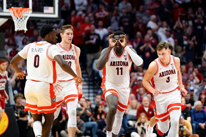 Dec 10, 2022; Las Vegas, Nevada, USA; Arizona Wildcats center Oumar Ballo (11) reacts with teammates after scoring against the Indiana Hoosiers during the second half at MGM Grand Garden Arena. Mandatory Credit: Lucas Peltier-USA TODAY Sports