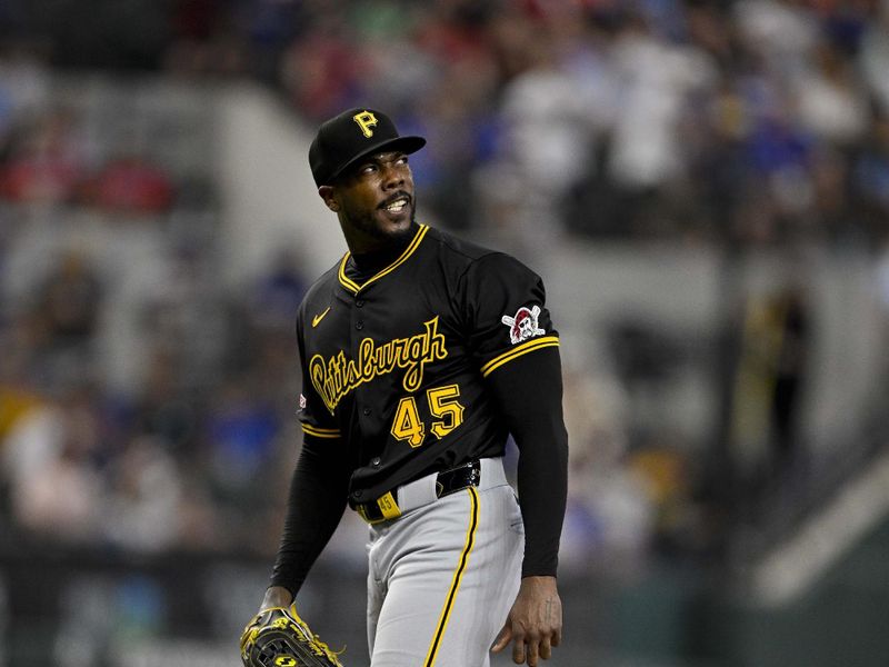 Aug 21, 2024; Arlington, Texas, USA; Pittsburgh Pirates relief pitcher Aroldis Chapman (45) checks the scoreboard after he pitches against the Texas Rangers during the eighth inning at Globe Life Field. Mandatory Credit: Jerome Miron-USA TODAY Sports
