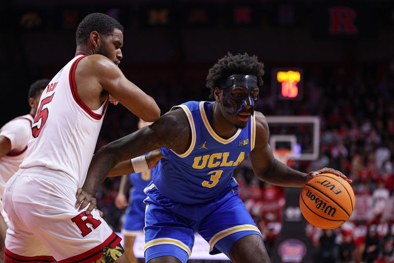 Jan 13, 2025; Piscataway, New Jersey, USA;  UCLA Bruins guard Eric Dailey Jr. (3) is guarded by Rutgers Scarlet Knights guard Tyson Acuff (5) during the first half at Jersey Mike's Arena. Mandatory Credit: Vincent Carchietta-Imagn Images