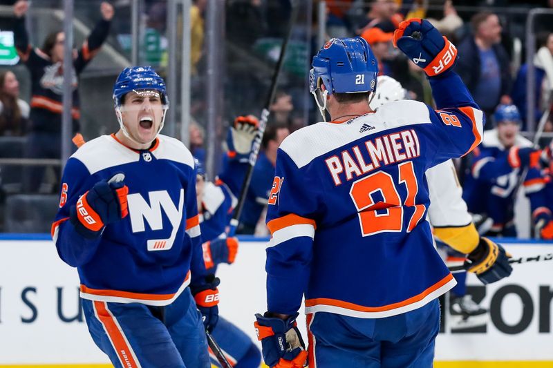 Apr 6, 2024; Elmont, New York, USA; New York Islanders center Kyle Palmieri (21) celebrates with defenseman Ryan Pulock (6) after scoring an empty net goal against the Nashville Predators during the third period at UBS Arena. Mandatory Credit: Tom Horak-USA TODAY Sports