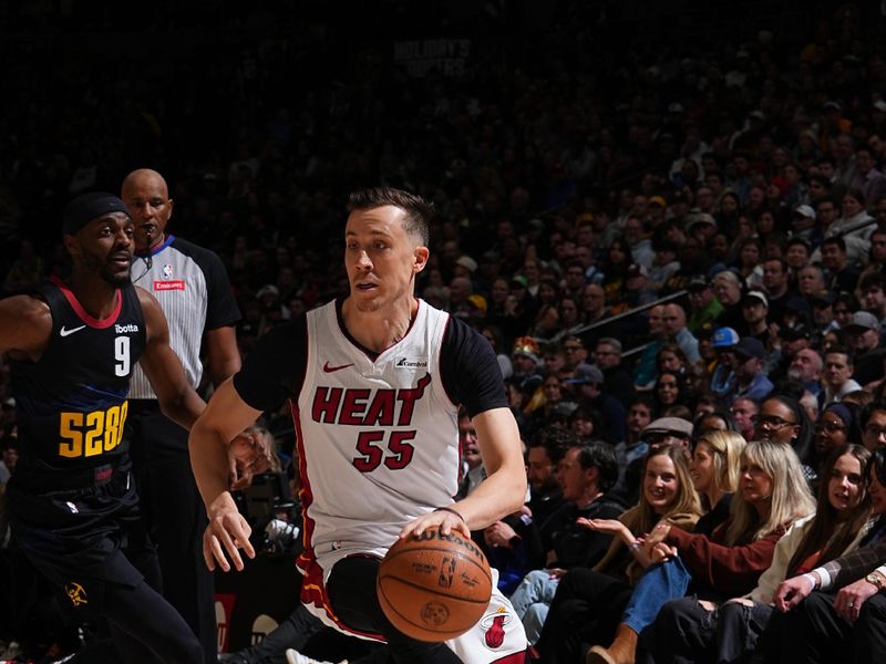 DENVER, CO - FEBRUARY 29: Duncan Robinson #55 of the Miami Heat dribbles the ball during the game against the Denver Nuggets on February 29, 2024 at the Ball Arena in Denver, Colorado. NOTE TO USER: User expressly acknowledges and agrees that, by downloading and/or using this Photograph, user is consenting to the terms and conditions of the Getty Images License Agreement. Mandatory Copyright Notice: Copyright 2024 NBAE (Photo by Garrett Ellwood/NBAE via Getty Images)