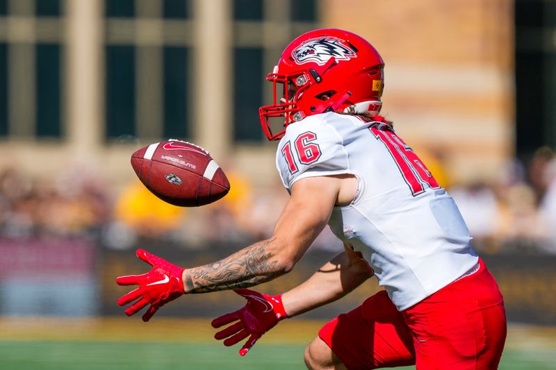 Sep 30, 2023; Laramie, Wyoming, USA; New Mexico Lobos wide receiver Ryan Davis (16) makes a catch against the Wyoming Cowboys during the first quarter at Jonah Field at War Memorial Stadium. Mandatory Credit: Troy Babbitt-USA TODAY Sports

