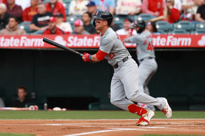 May 15, 2024; Anaheim, California, USA;  St. Louis Cardinals right fielder Lars Nootbaar (21) hits a double during the first inning against the Los Angeles Angels at Angel Stadium. Mandatory Credit: Kiyoshi Mio-USA TODAY Sports