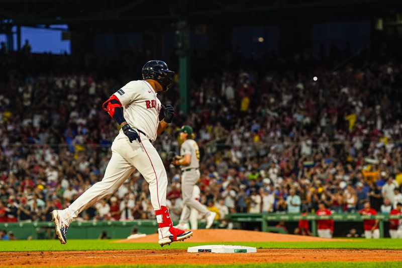 Jul 9, 2024; Boston, Massachusetts, USA; Boston Red Sox first baseman Dominic Smith (2) hits a home run against the Oakland Athletics in the second inning at Fenway Park. Mandatory Credit: David Butler II-USA TODAY Sports