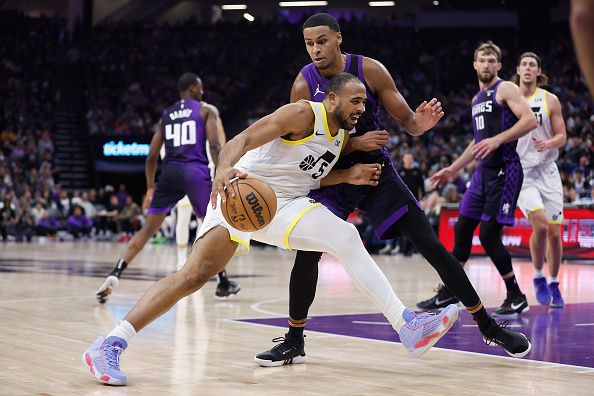 SACRAMENTO, CALIFORNIA - DECEMBER 16: Talen Horton-Tucker #5 of the Utah Jazz is guarded by Keegan Murray #13 of the Sacramento Kings in the second quarter at Golden 1 Center on December 16, 2023 in Sacramento, California. NOTE TO USER: User expressly acknowledges and agrees that, by downloading and or using this photograph, User is consenting to the terms and conditions of the Getty Images License Agreement. (Photo by Lachlan Cunningham/Getty Images)