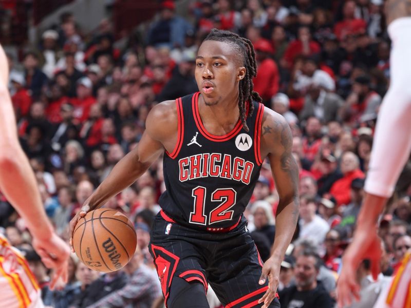 CHICAGO, IL - APRIL 17:  Ayo Dosunmu #12 of the Chicago Bulls handles the ball during the game  against the Atlanta Hawks during the 2024 Play-In Tournament  on April 17, 2024 at United Center in Chicago, Illinois. NOTE TO USER: User expressly acknowledges and agrees that, by downloading and or using this photograph, User is consenting to the terms and conditions of the Getty Images License Agreement. Mandatory Copyright Notice: Copyright 2024 NBAE (Photo by Jeff Haynes/NBAE via Getty Images)