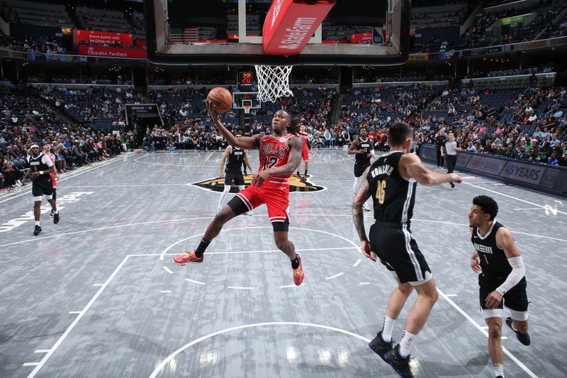 MEMPHIS, TN - FEBRUARY 8: Ayo Dosunmu #12 of the Chicago Bulls drives to the basket during the game against the Memphis Grizzlies on February 8, 2024 at FedExForum in Memphis, Tennessee. NOTE TO USER: User expressly acknowledges and agrees that, by downloading and or using this photograph, User is consenting to the terms and conditions of the Getty Images License Agreement. Mandatory Copyright Notice: Copyright 2024 NBAE (Photo by Joe Murphy/NBAE via Getty Images)