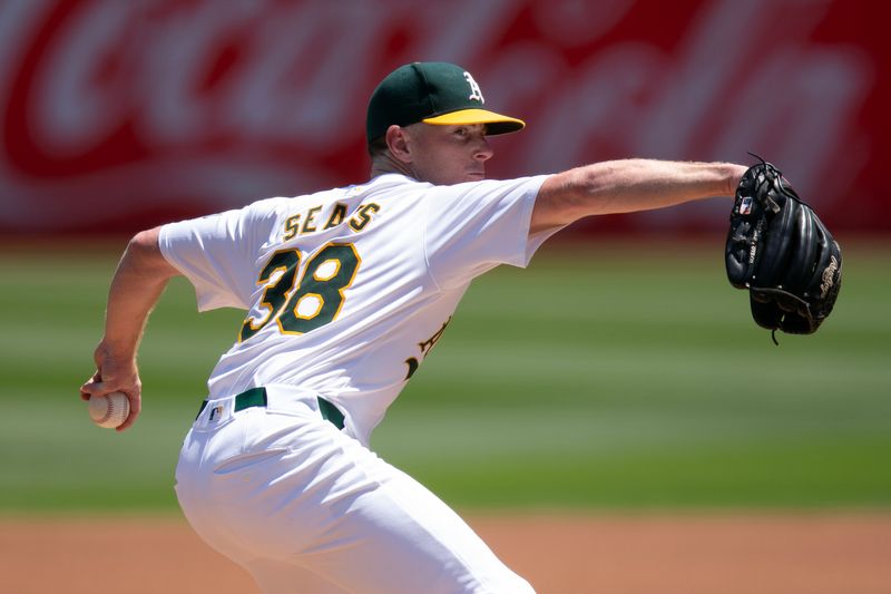 Jul 24, 2024; Oakland, California, USA; Oakland Athletics starting pitcher JP Sears (38) delivers against the Houston Astros during the first inning at Oakland-Alameda County Coliseum. Mandatory Credit: D. Ross Cameron-USA TODAY Sports