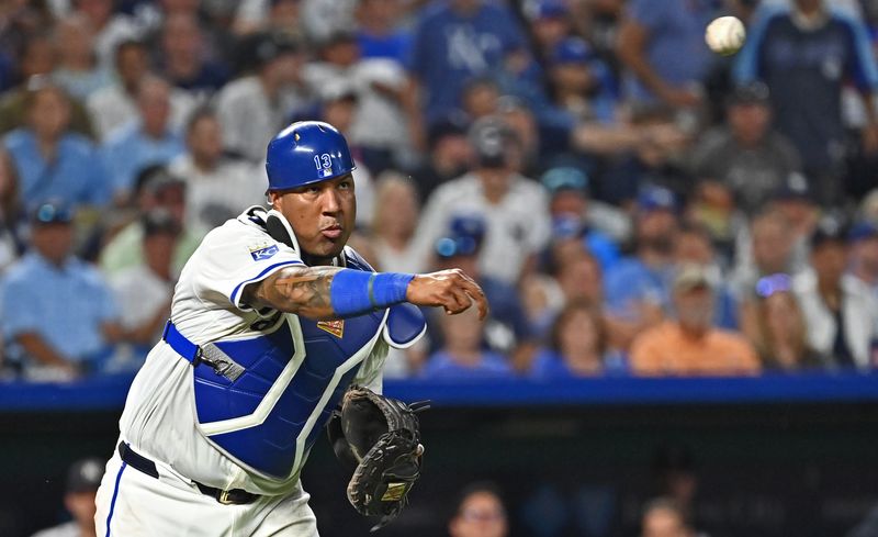 Jun 11, 2024; Kansas City, Missouri, USA; Kansas City Royals catcher Salvador Perez (13) throws the ball to first base for an out in the seventh inning against the New York Yankees at Kauffman Stadium. Mandatory Credit: Peter Aiken-USA TODAY Sports