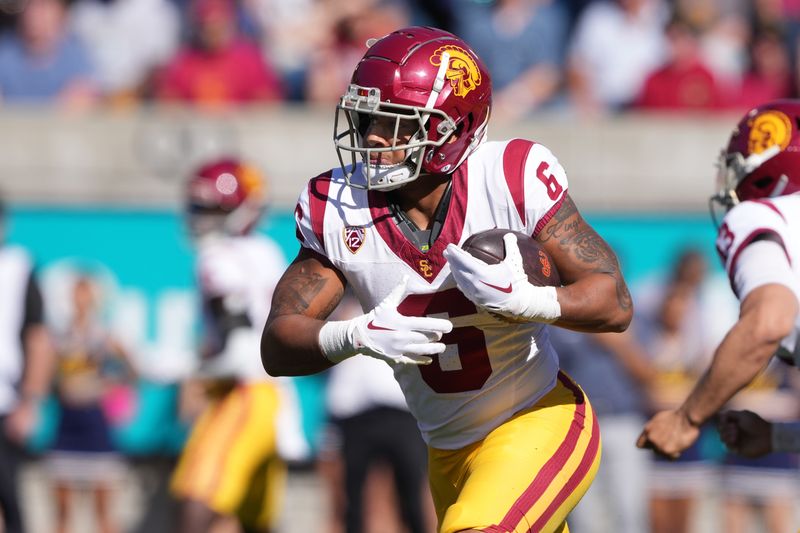 Oct 28, 2023; Berkeley, California, USA; USC Trojans running back Austin Jones (6) carries the ball against the California Golden Bears during the second quarter at California Memorial Stadium. Mandatory Credit: Darren Yamashita-USA TODAY Sports