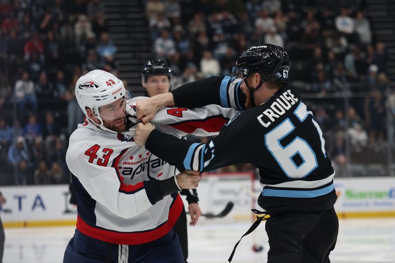 Mar 26, 2026; Salt Lake City, Utah, USA; Washington Capitals right wing Tom Wilson (43) and Utah Mammoth left wing Lawson Crouse (67) fight during the third period at Delta Center. Mandatory Credit: Rob Gray-Imagn Images