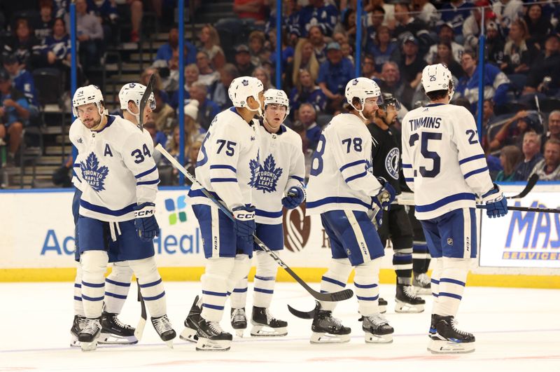 Apr 17, 2024; Tampa, Florida, USA; Toronto Maple Leafs defenseman TJ Brodie (78) is congratulated by defenseman Conor Timmins (25),  right wing Ryan Reaves (75), center Auston Matthews (34) and teammates during the third period at Amalie Arena. Mandatory Credit: Kim Klement Neitzel-USA TODAY Sports