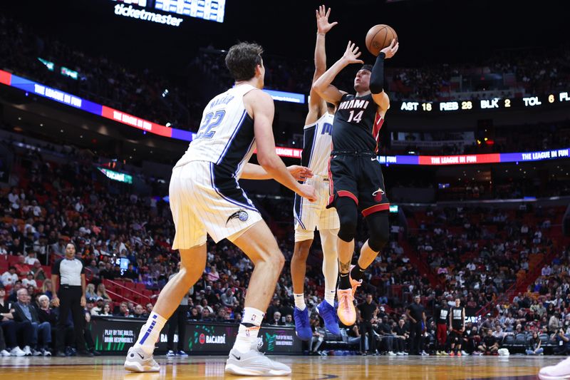 MIAMI, FLORIDA - FEBRUARY 06: Tyler Herro #14 of the Miami Heat shoots the ball against the Orlando Magic during the third quarter of the game at Kaseya Center on February 06, 2024 in Miami, Florida. NOTE TO USER: User expressly acknowledges and agrees that, by downloading and or using this photograph, User is consenting to the terms and conditions of the Getty Images License Agreement. (Photo by Megan Briggs/Getty Images)