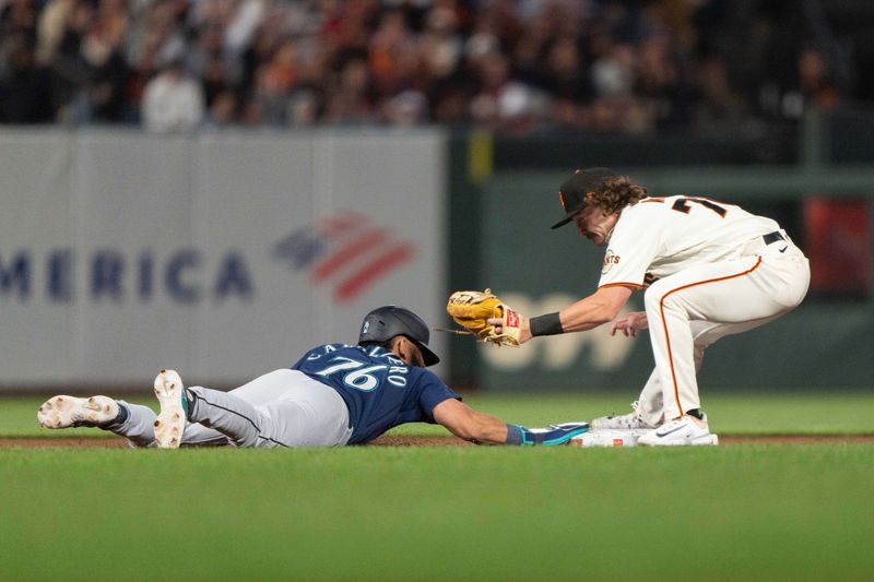 Jul 3, 2023; San Francisco, California, USA;  Seattle Mariners second baseman Jose Caballero (76) dives back to second base during the ninth inning against San Francisco Giants second baseman Brett Wisely (70) at Oracle Park. Mandatory Credit: Stan Szeto-USA TODAY Sports