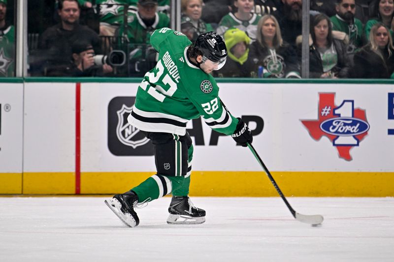 Jan 20, 2026; Dallas, Texas, USA;  Dallas Stars center Mavrik Bourque (22) shoots the puck in the Boston Bruins zone during the first period at the American Airlines Center. Mandatory Credit: Jerome Miron-Imagn Images