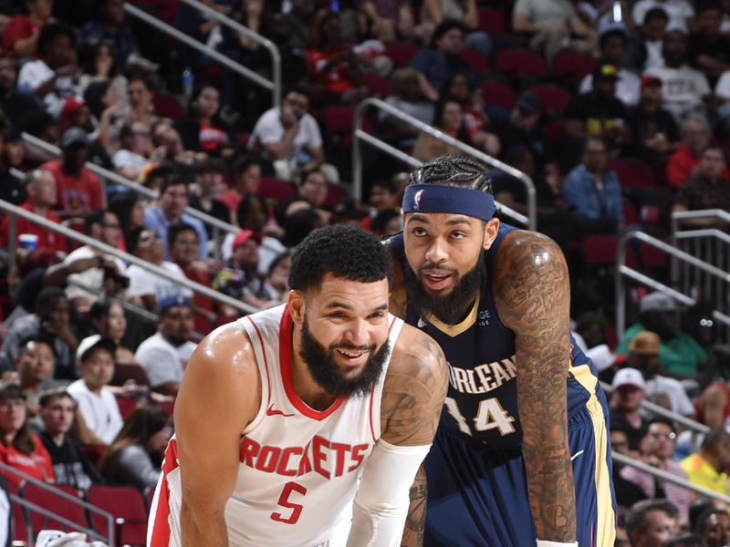 HOUSTON, TX - OCTOBER 15: Fred VanVleet #5 of the Houston Rockets and Brandon Ingram #14 of the New Orleans Pelicans smile during the game during a NBA preseason game on October 15, 2024 at the Toyota Center in Houston, Texas. NOTE TO USER: User expressly acknowledges and agrees that, by downloading and or using this photograph, User is consenting to the terms and conditions of the Getty Images License Agreement. Mandatory Copyright Notice: Copyright 2024 NBAE (Photo by Logan Riely/NBAE via Getty Images)