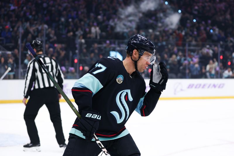 Nov 15, 2025; Seattle, Washington, USA; Seattle Kraken center Jaden Schwartz (17) skates off after scoring a goal in the first period against the San Jose Sharks at Climate Pledge Arena. Mandatory Credit: Kevin Ng-Imagn Images