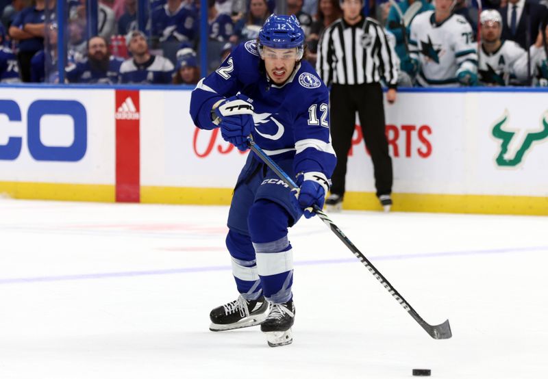 Oct 26, 2023; Tampa, Florida, USA; Tampa Bay Lightning center Alex Barre-Boulet (12) skates with the puck against the San Jose Sharks during the first period at Amalie Arena. Mandatory Credit: Kim Klement Neitzel-USA TODAY Sports