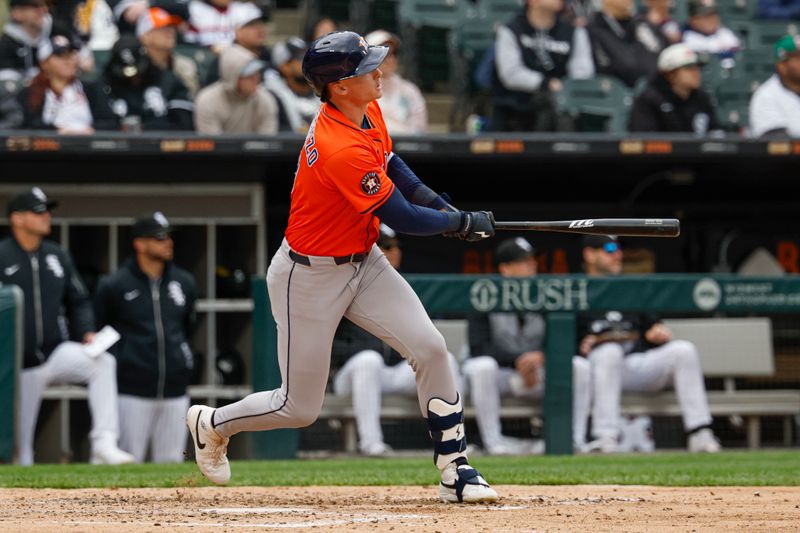 May 4, 2025; Chicago, Illinois, USA; Houston Astros right fielder Zach Dezenzo (9) hits a two-run home run against the Chicago White Sox during the fifth inning at Rate Field. Mandatory Credit: Kamil Krzaczynski-Imagn Images