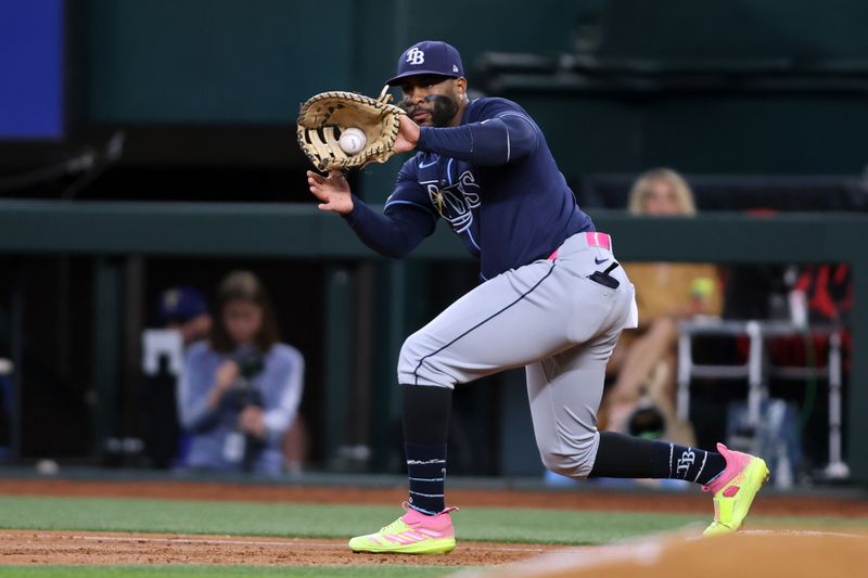 Jul 7, 2024; Arlington, Texas, USA; Tampa Bay Rays first base Yandy Díaz (2) makes a put out at first base in the first inning against the Texas Rangers at Globe Life Field. Mandatory Credit: Tim Heitman-USA TODAY Sports