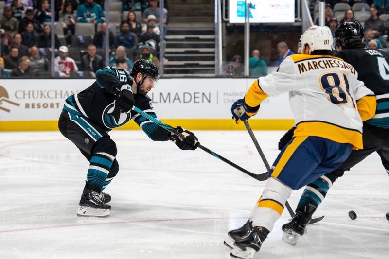 Jan 23, 2025; San Jose, California, USA;  San Jose Sharks defenseman Jake Walman (96) passes the puck against Nashville Predators center Jonathan Marchessault (81) during the first period at SAP Center at San Jose. Mandatory Credit: Neville E. Guard-Imagn Images