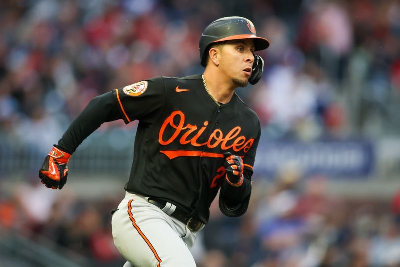 May 5, 2023; Atlanta, Georgia, USA; Baltimore Orioles second baseman Ramon Urias (29) hits a single against the Atlanta Braves in the second inning at Truist Park. Mandatory Credit: Brett Davis-USA TODAY Sports